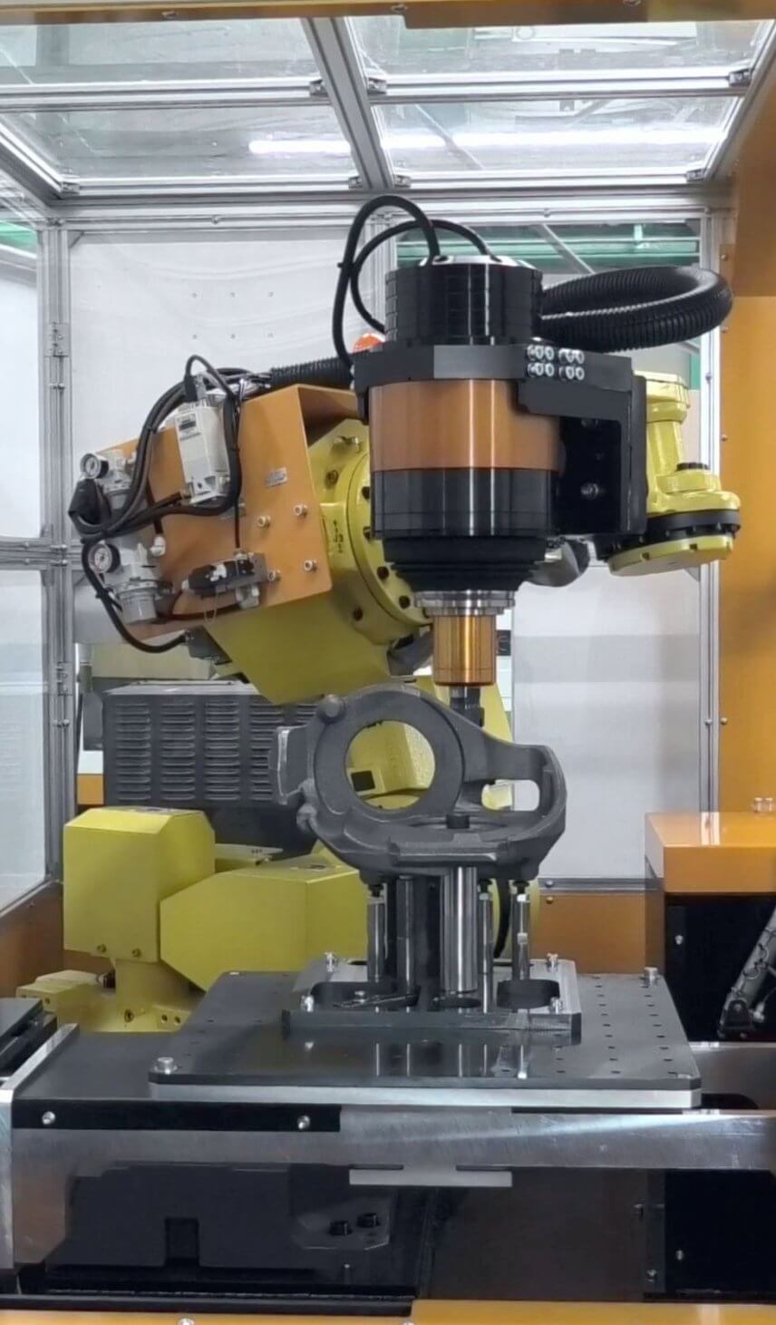 Casting deburring robot cell